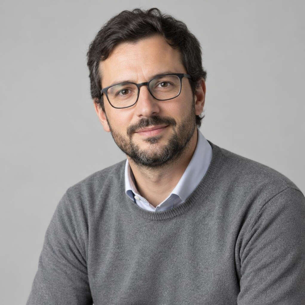Portrait of a Uruguayan man historian in his late thirties with a short beard and glasses