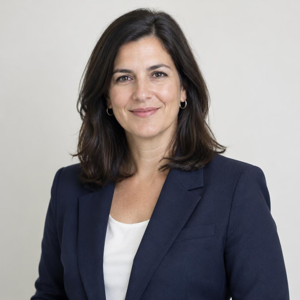 Portrait of a Uruguayan woman editor in her forties with dark hair smiling slightly